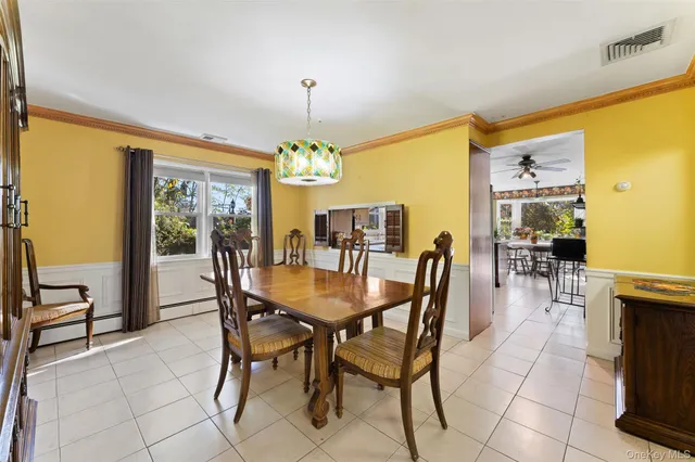 a dining room with furniture and chandelier or kitchen