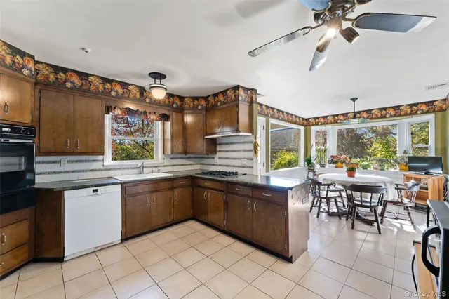 a kitchen with lots of counter top space and dining table