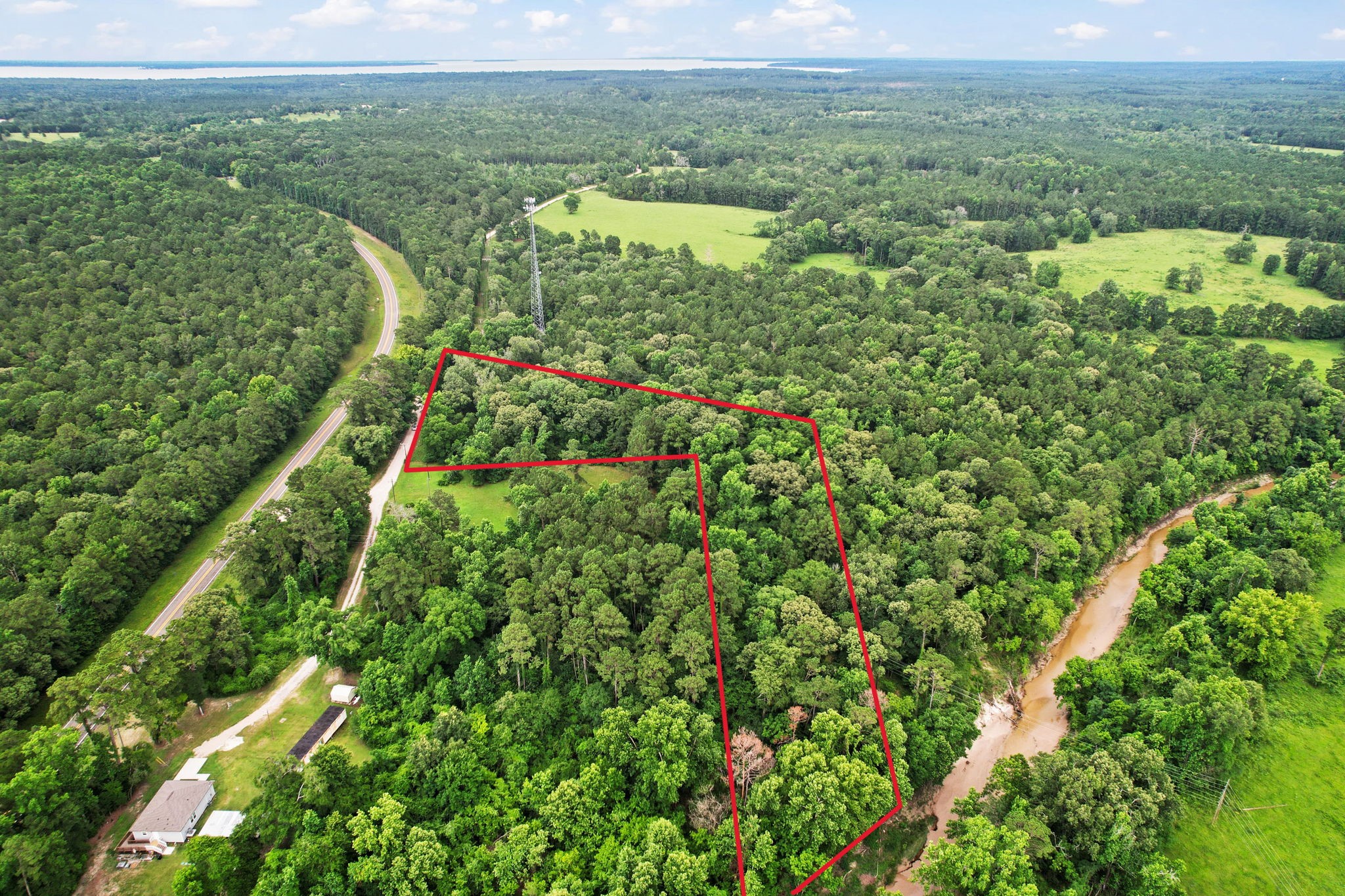 Tbd Ryan Ferry Road Point Blank, TX 77364 - Photo 14 of 34 a view of a city with lush green forest