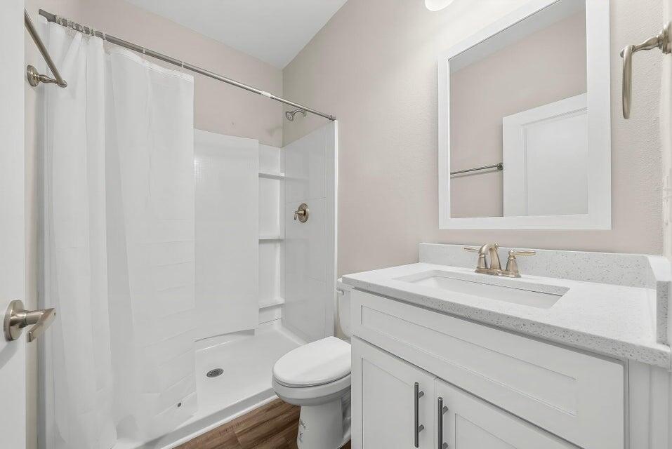 131 North Sand Palm Road, Unit VISTA Freeport, FL 32439 - Photo 16 of 27 a bathroom with a sink toilet and shower