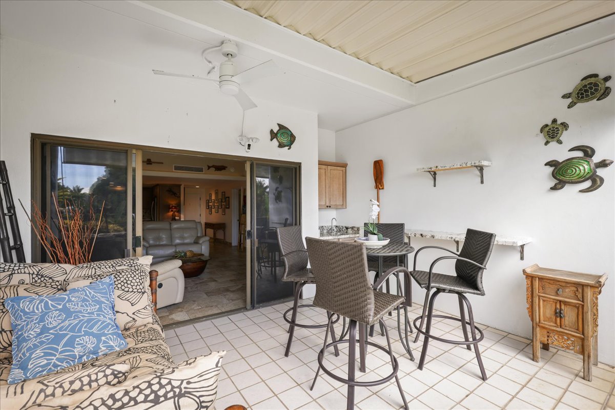 75-6040 Alii Drive, Unit 303 Kailua-Kona, HI 96740 - Photo 11 of 24 a view of a livingroom with furniture window and outside view