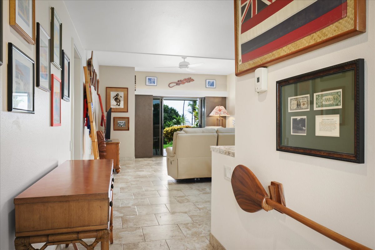 75-6040 Alii Drive, Unit 303 Kailua-Kona, HI 96740 - Photo 4 of 24 a living room with furniture and a window