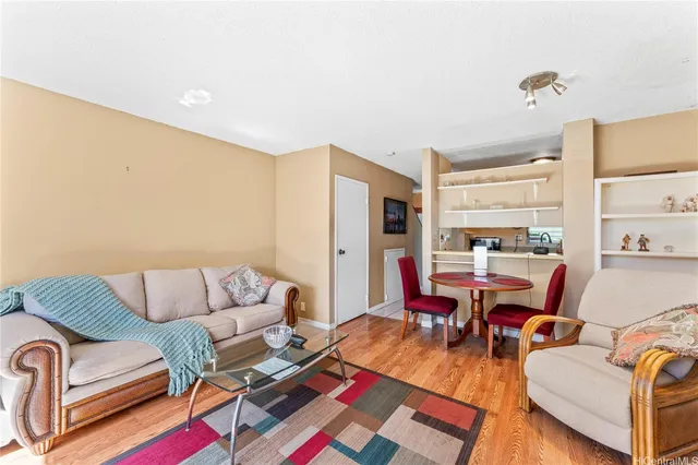 a living room with furniture and a table