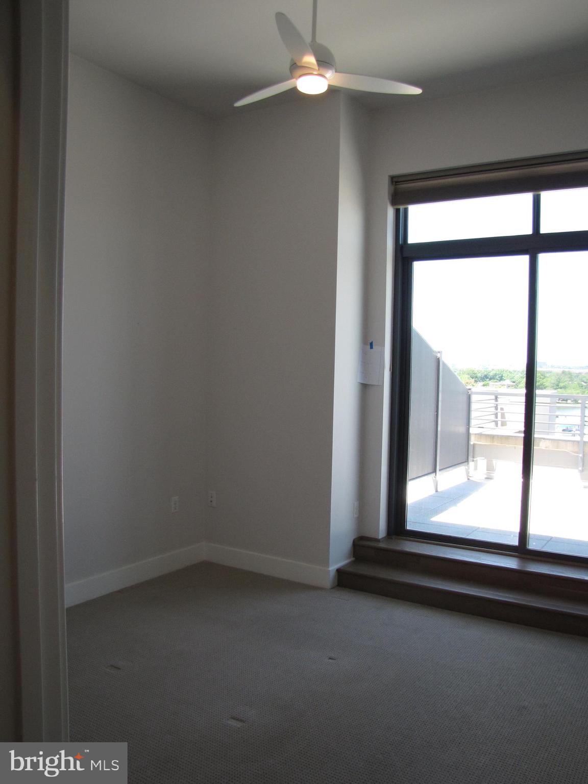 525 Water Street Southwest, Unit 404 Washington, DC 20024 - Photo 11 of 31 Master bedroom overlooks terrace.