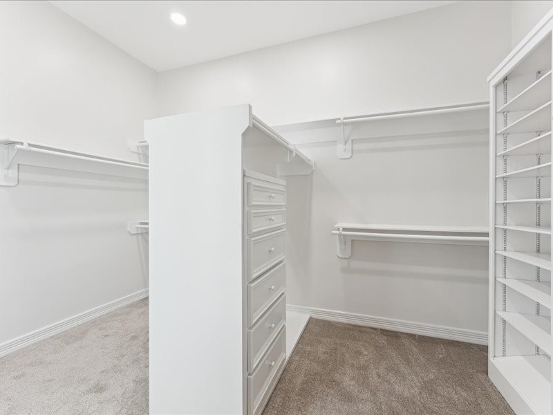 11404 Island Manor Street Pearland, TX 77584 - Photo 25 of 42 The primary bedroom features a generous walk-in closet with excellent storage.