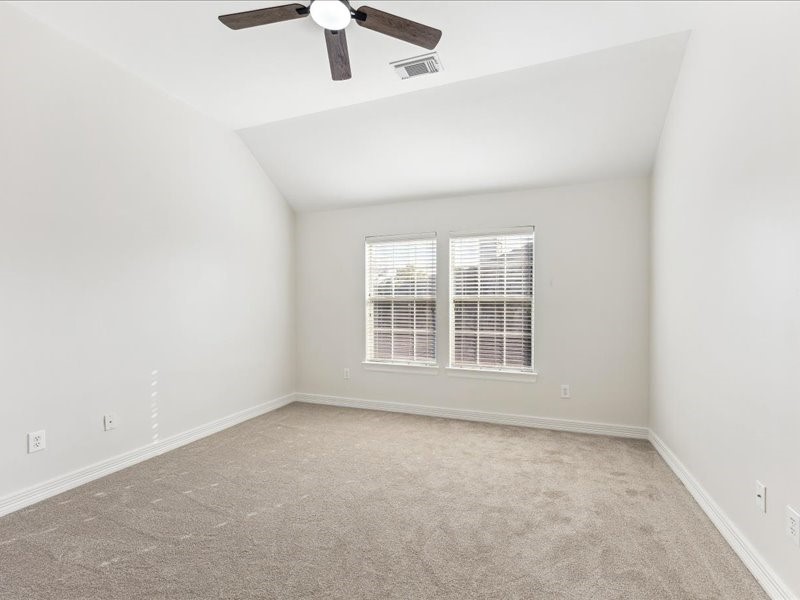 11404 Island Manor Street Pearland, TX 77584 - Photo 29 of 42 One of the three upstairs bedrooms offers new carpet and premium padding for added comfort.