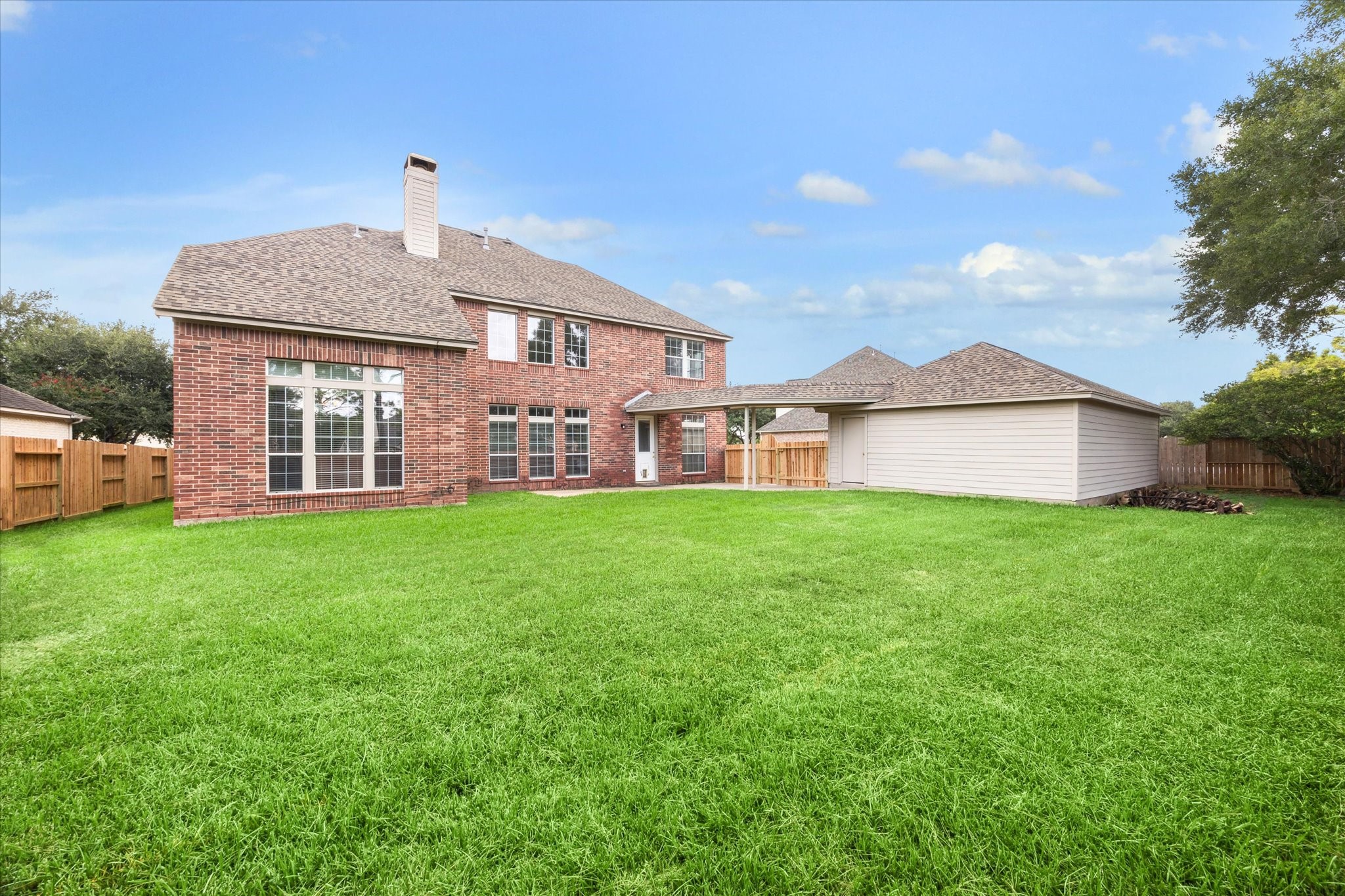 11404 Island Manor Street Pearland, TX 77584 - Photo 3 of 42 Expansive backyard spanning over a quarter acre, offering exceptional space to relax, play, or entertain.