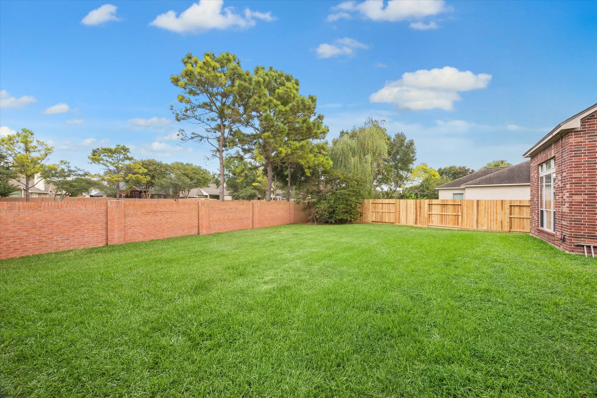 11404 Island Manor Street Pearland, TX 77584 - Photo 4 of 42 Another view of the amazing space in the backyard, endless possibilities.