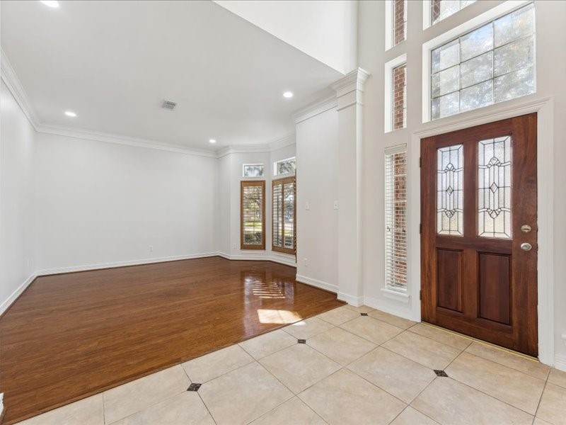 11404 Island Manor Street Pearland, TX 77584 - Photo 8 of 42 Designed for comfort and connection, the inviting den offers extra space for family gatherings and entertaining friends.