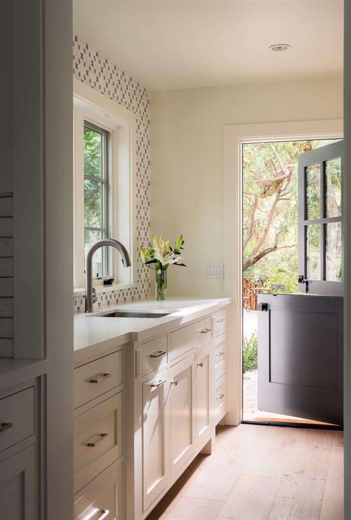 1221 Foothill Road Ojai, CA 93023 - Photo 13 of 42 a view of cabinets a sink and a window