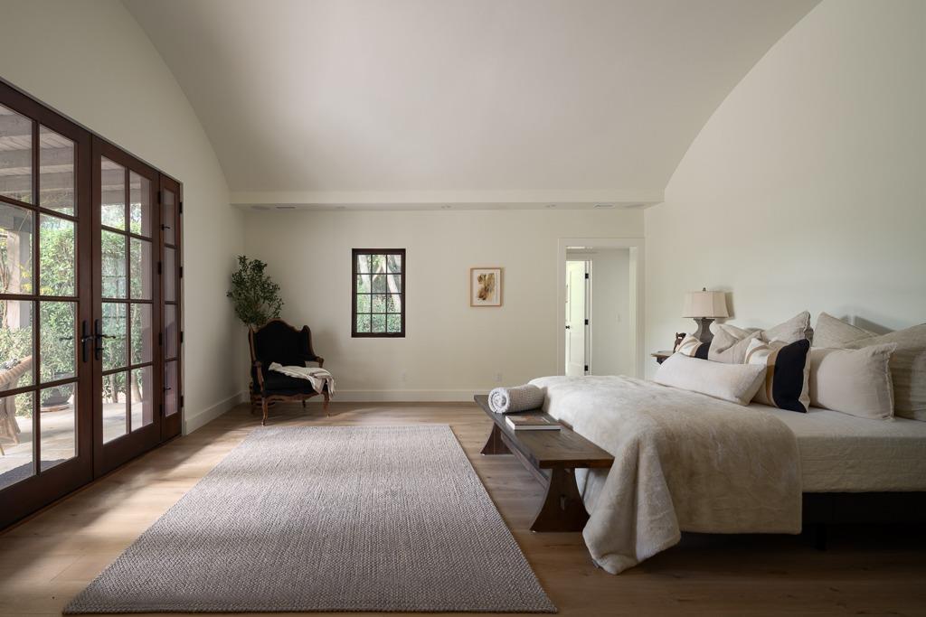 1221 Foothill Road Ojai, CA 93023 - Photo 14 of 42 a bedroom with a bed and a window