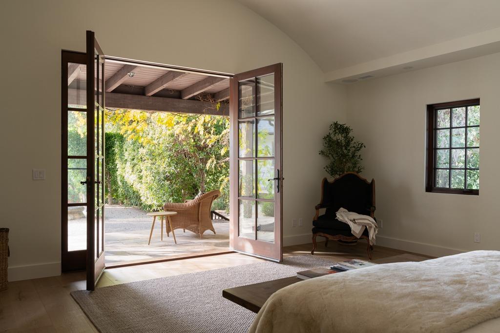 1221 Foothill Road Ojai, CA 93023 - Photo 15 of 42 a view of a room with furniture and floor to ceiling window
