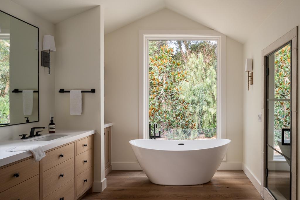 1221 Foothill Road Ojai, CA 93023 - Photo 16 of 42 a bathroom with a bathtub and sink