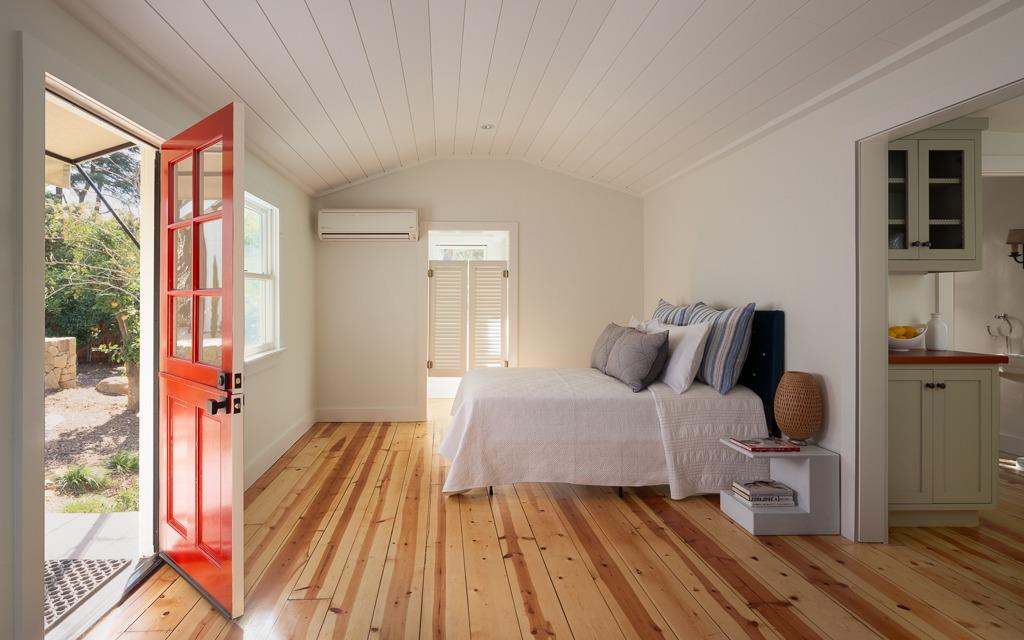 1221 Foothill Road Ojai, CA 93023 - Photo 27 of 42 a bedroom with a bed and wooden floor