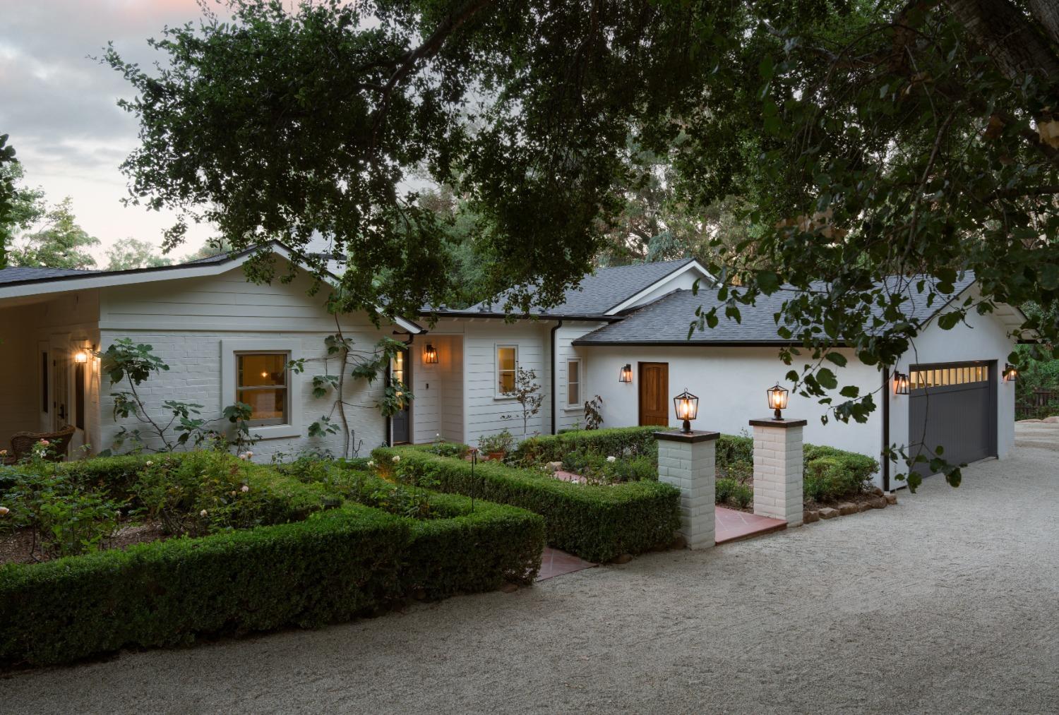 1221 Foothill Road Ojai, CA 93023 - Photo 5 of 42 a front view of a house with garden