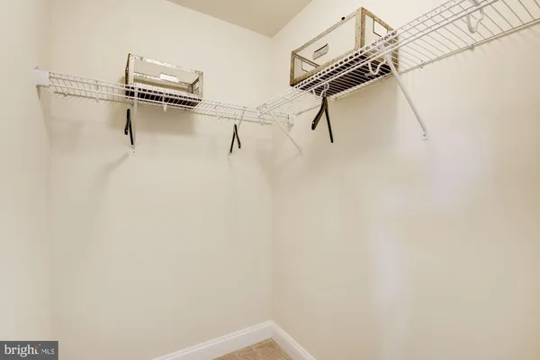 a bedroom with a bed and a night stand