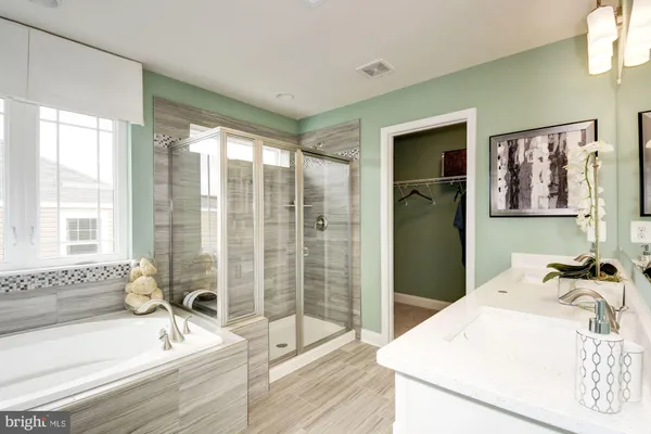 a kitchen with stainless steel appliances granite countertop a stove and a sink