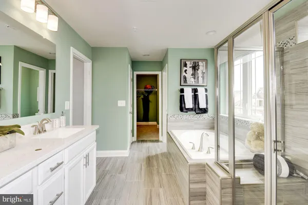 a living room with furniture and a large window with wooden floor