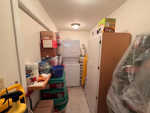 a backyard of a house with a yard and outdoor seating