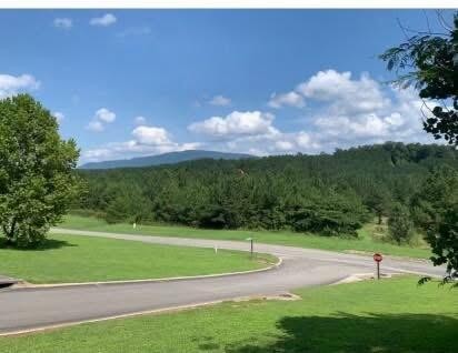 109 Cherokee Ridge Drive Ocoee, TN 37361 - Photo 2 of 22 a view of a golf course with a lake