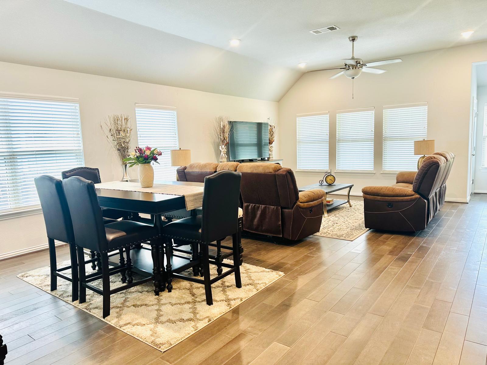 862 Leadtree Loop Buda, TX 78610 - Photo 7 of 40 a dining room with furniture window and wooden floor
