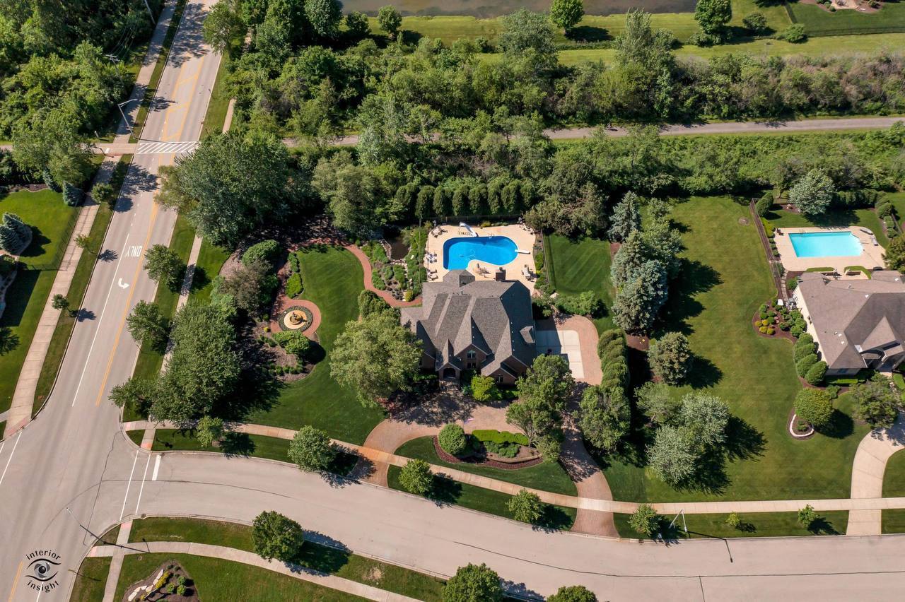 11617 Coach Drive Mokena, IL 60448 - Photo 12 of 38 an aerial view of a house with a yard and lake view