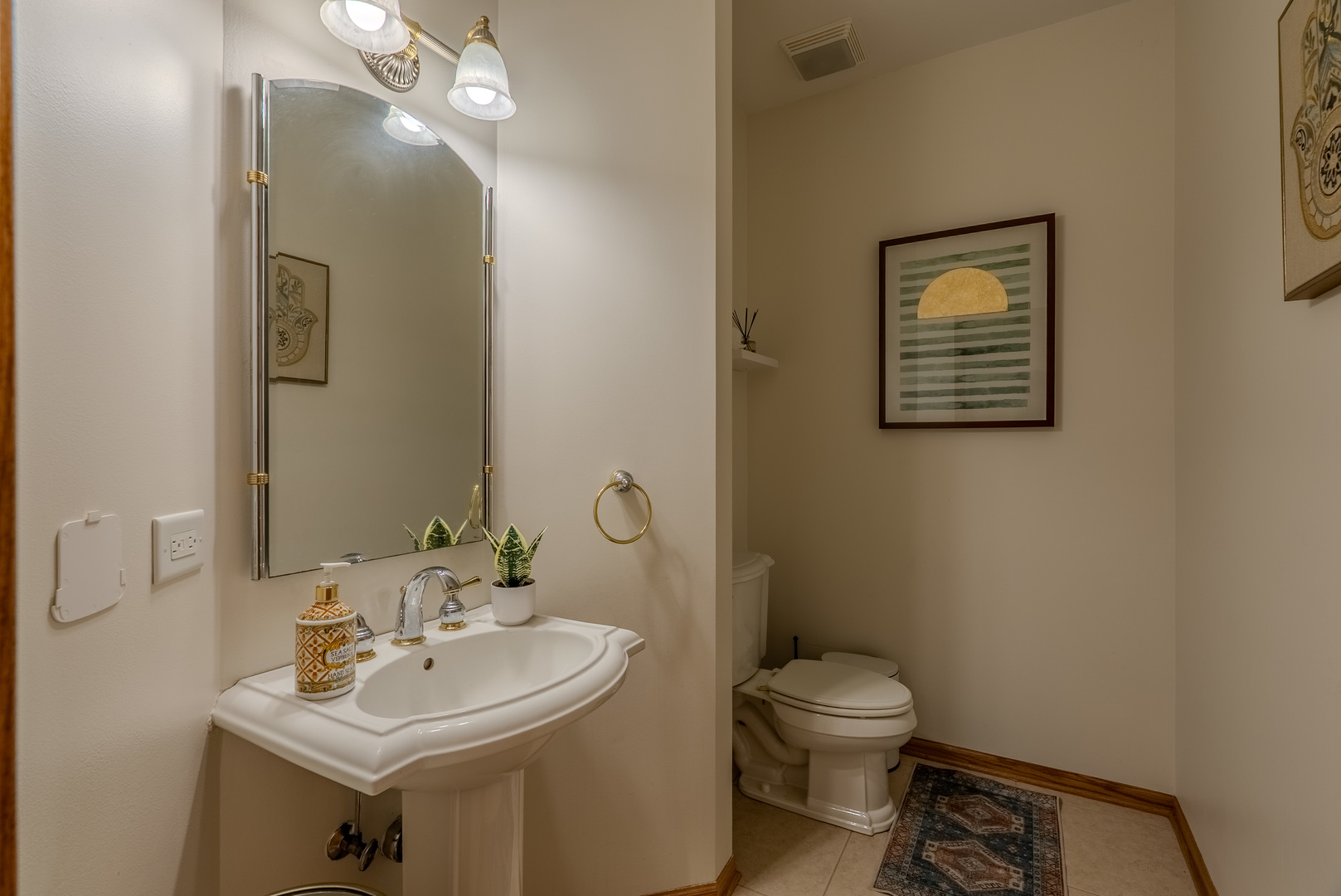 11617 Coach Drive Mokena, IL 60448 - Photo 24 of 38 a bathroom with a toilet a sink and mirror