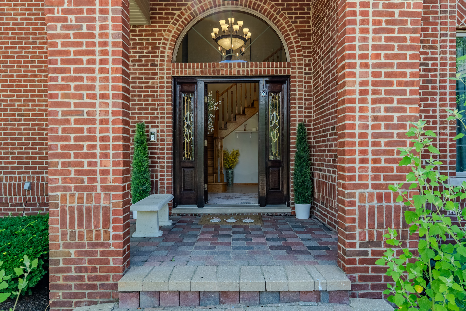 11617 Coach Drive Mokena, IL 60448 - Photo 3 of 38 a view of a brick house with potted plants