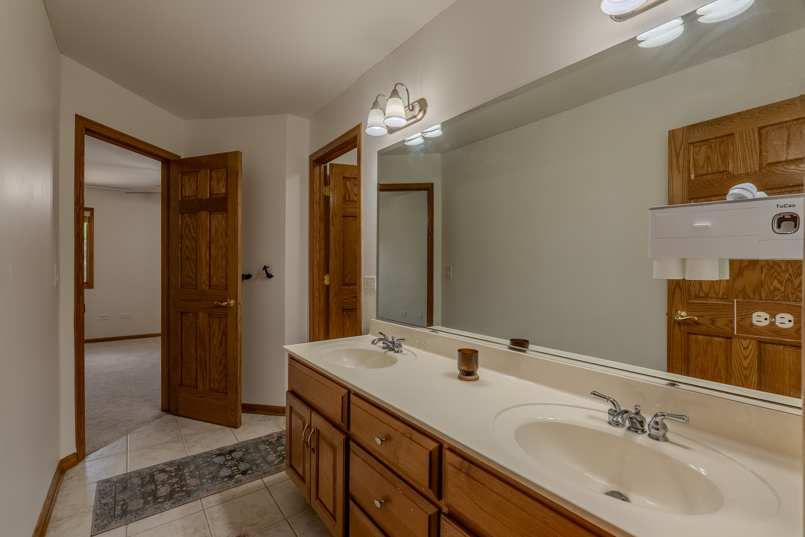 11617 Coach Drive Mokena, IL 60448 - Photo 33 of 38 a bathroom with a double vanity sink and a mirror