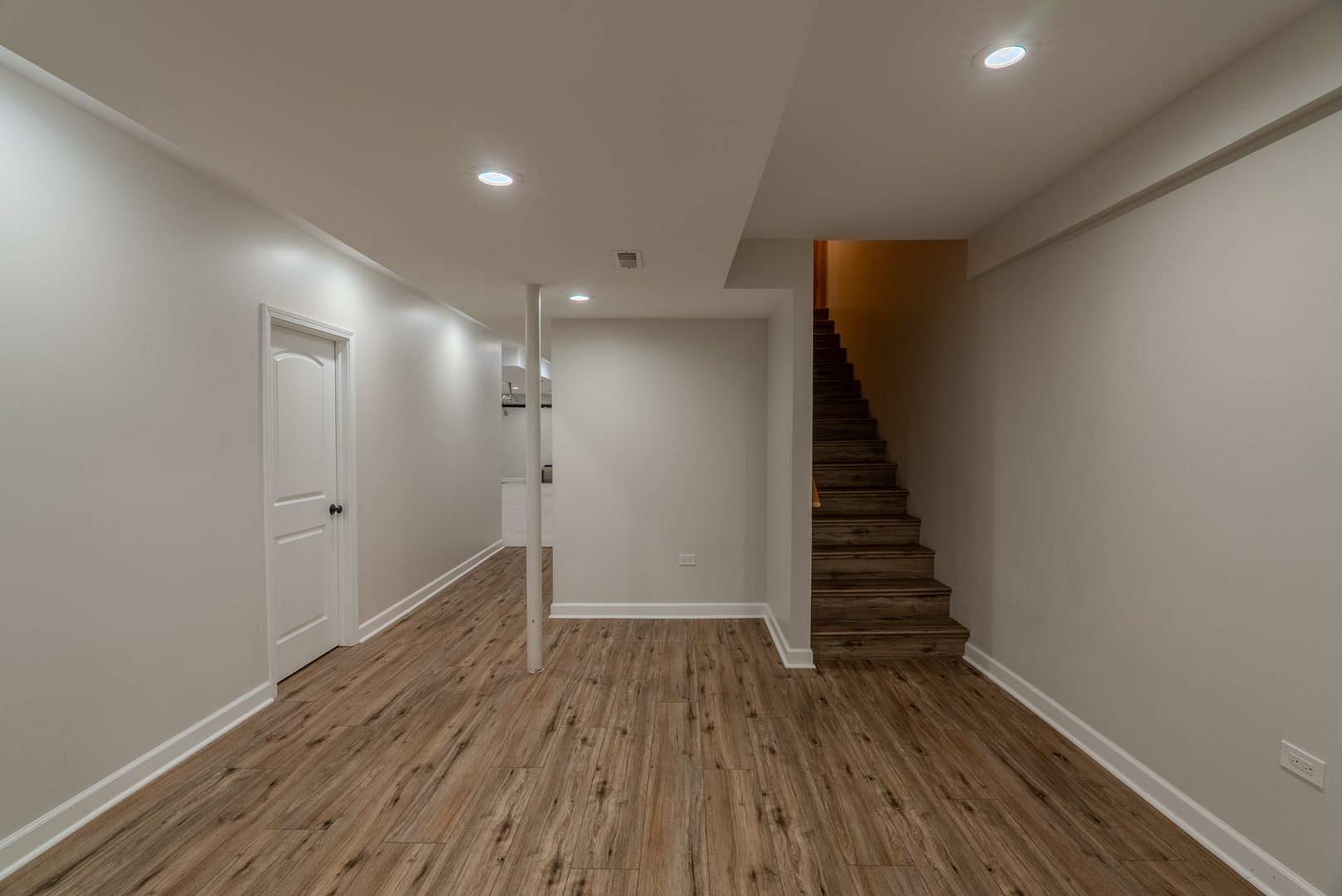 11617 Coach Drive Mokena, IL 60448 - Photo 35 of 38 a view of a hallway with wooden floor and staircase