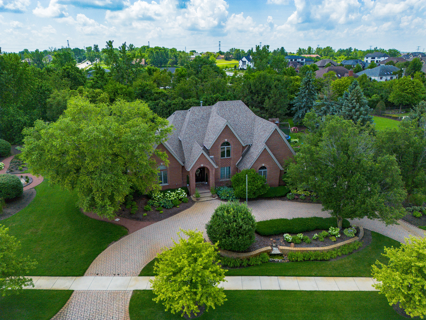 11617 Coach Drive Mokena, IL 60448 - Photo 4 of 38 an aerial view of a house with a big yard and large trees