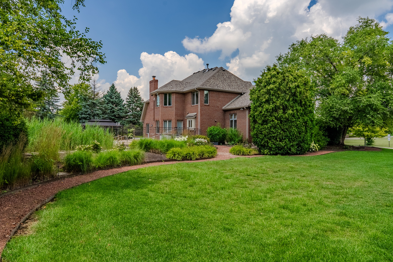 11617 Coach Drive Mokena, IL 60448 - Photo 5 of 38 a front view of a house with garden