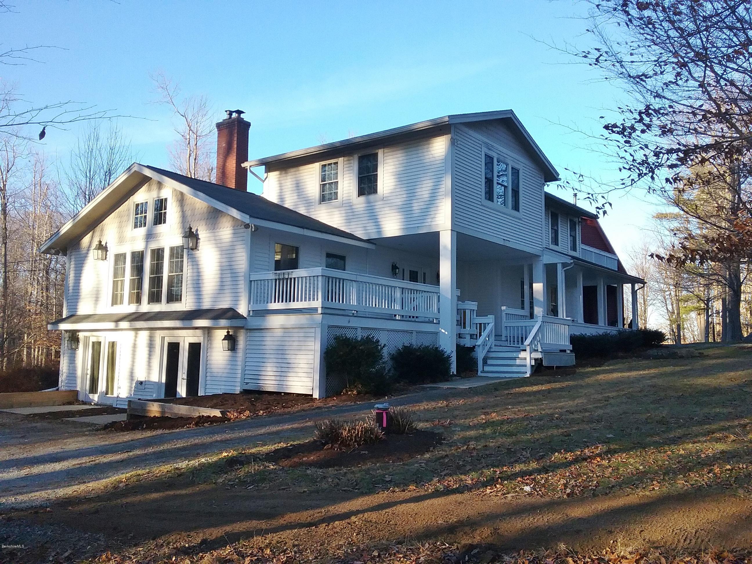 27 Kibbe Point Road Otis, MA 01029 - Photo 1 of 30 a front view of a house with a yard