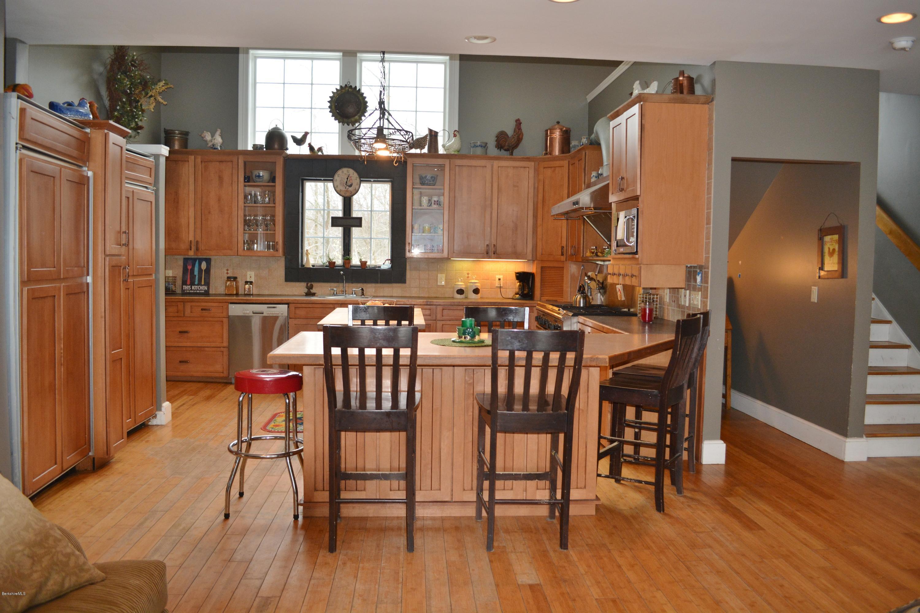 27 Kibbe Point Road Otis, MA 01029 - Photo 11 of 30 a dining room with furniture window and wooden floor