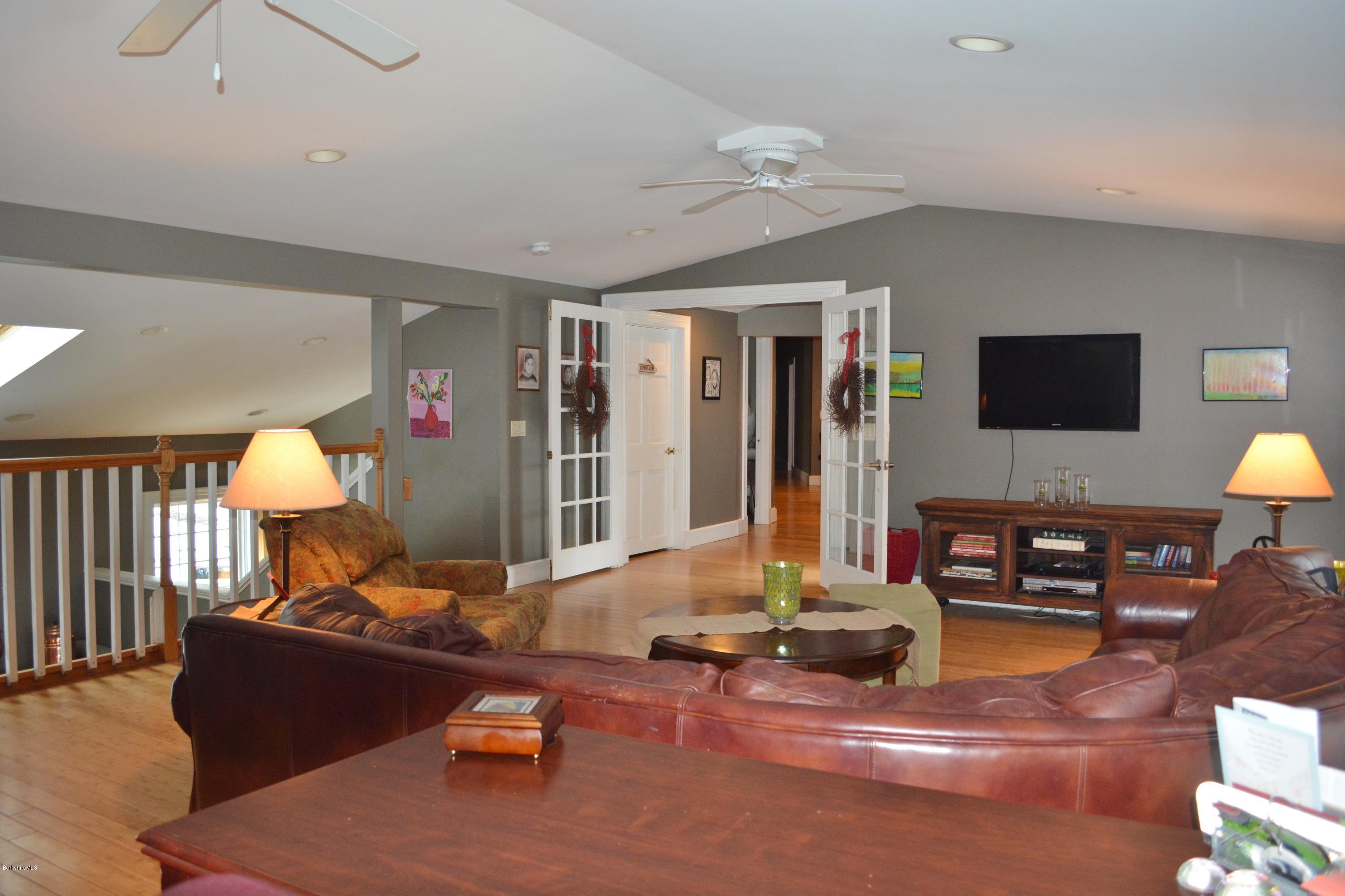 27 Kibbe Point Road Otis, MA 01029 - Photo 15 of 30 a living room with furniture and a flat screen tv
