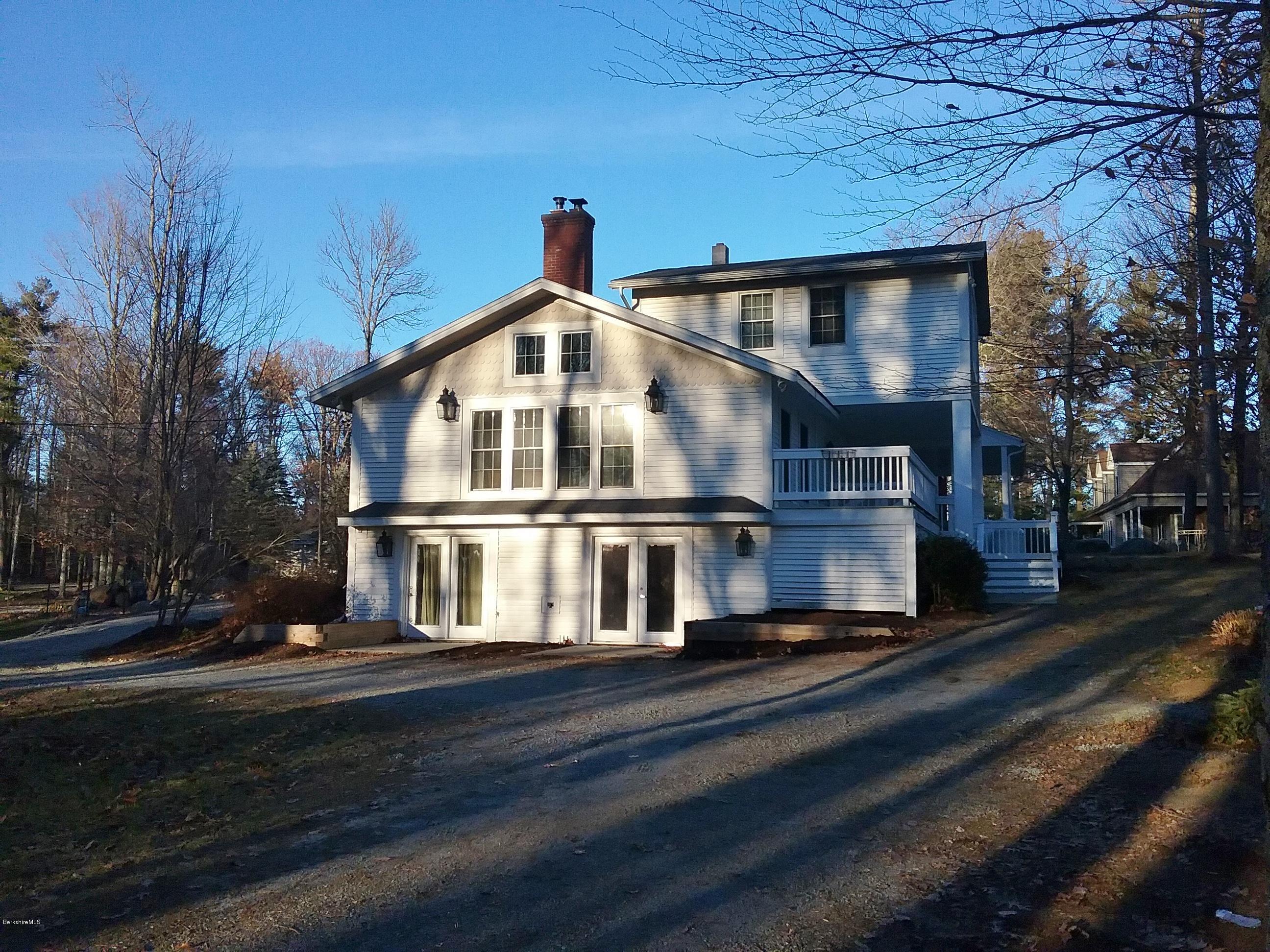 27 Kibbe Point Road Otis, MA 01029 - Photo 3 of 30 a front view of a house with a yard