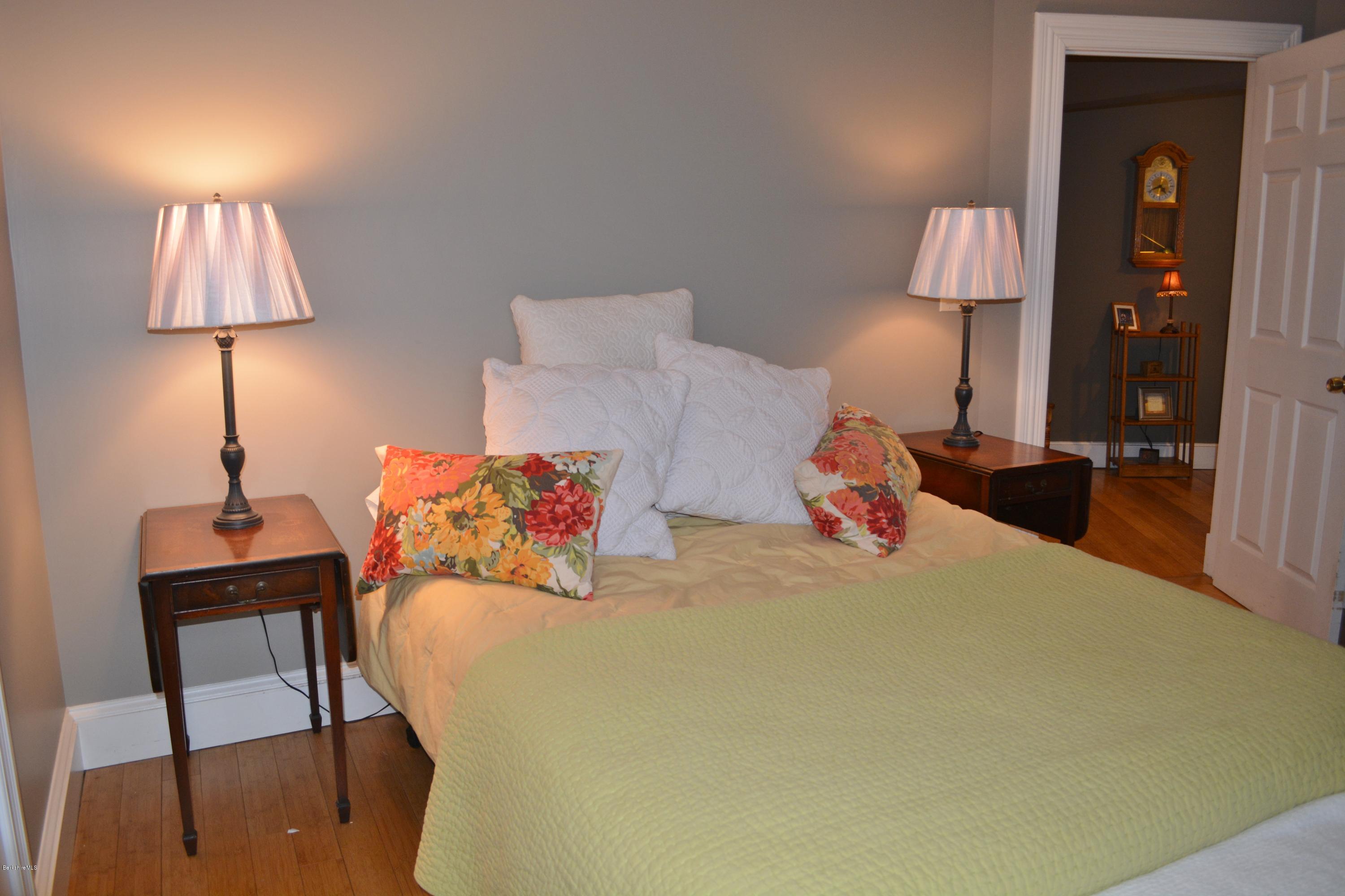 27 Kibbe Point Road Otis, MA 01029 - Photo 21 of 30 a bed room with a bed and a lamp