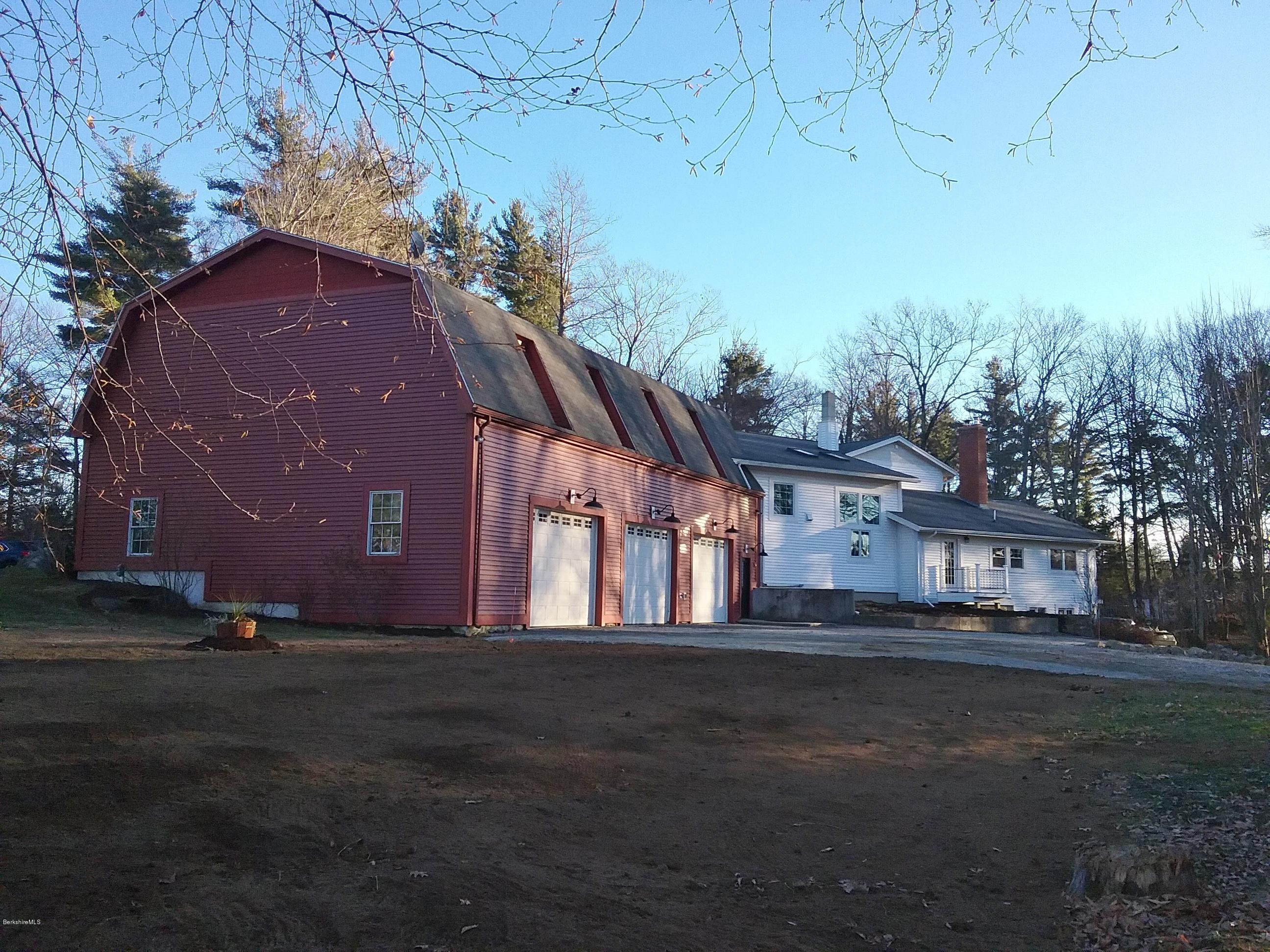 27 Kibbe Point Road Otis, MA 01029 - Photo 4 of 30 a front view of a house with a yard