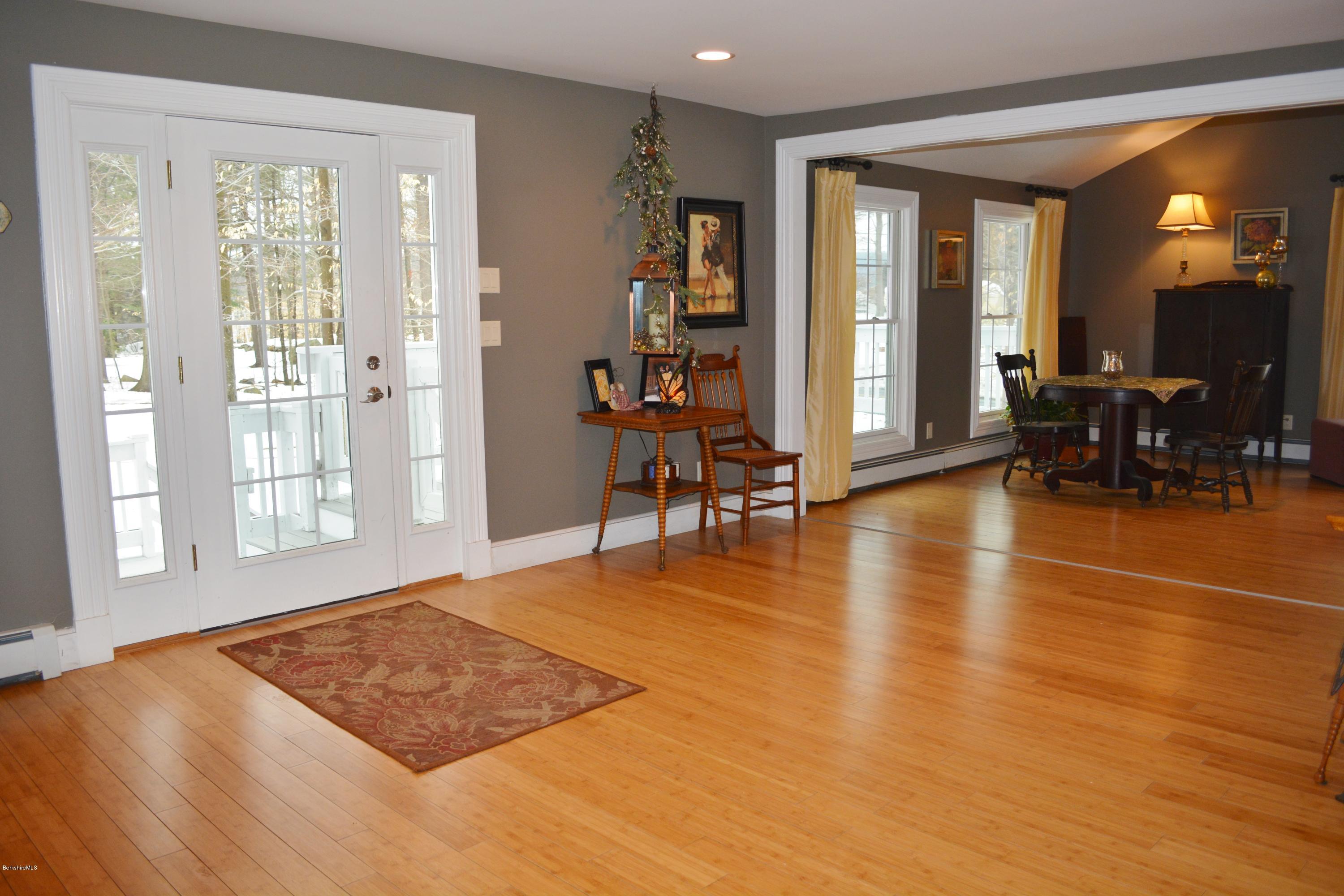 27 Kibbe Point Road Otis, MA 01029 - Photo 5 of 30 a view of livingroom with furniture wooden floor and windows