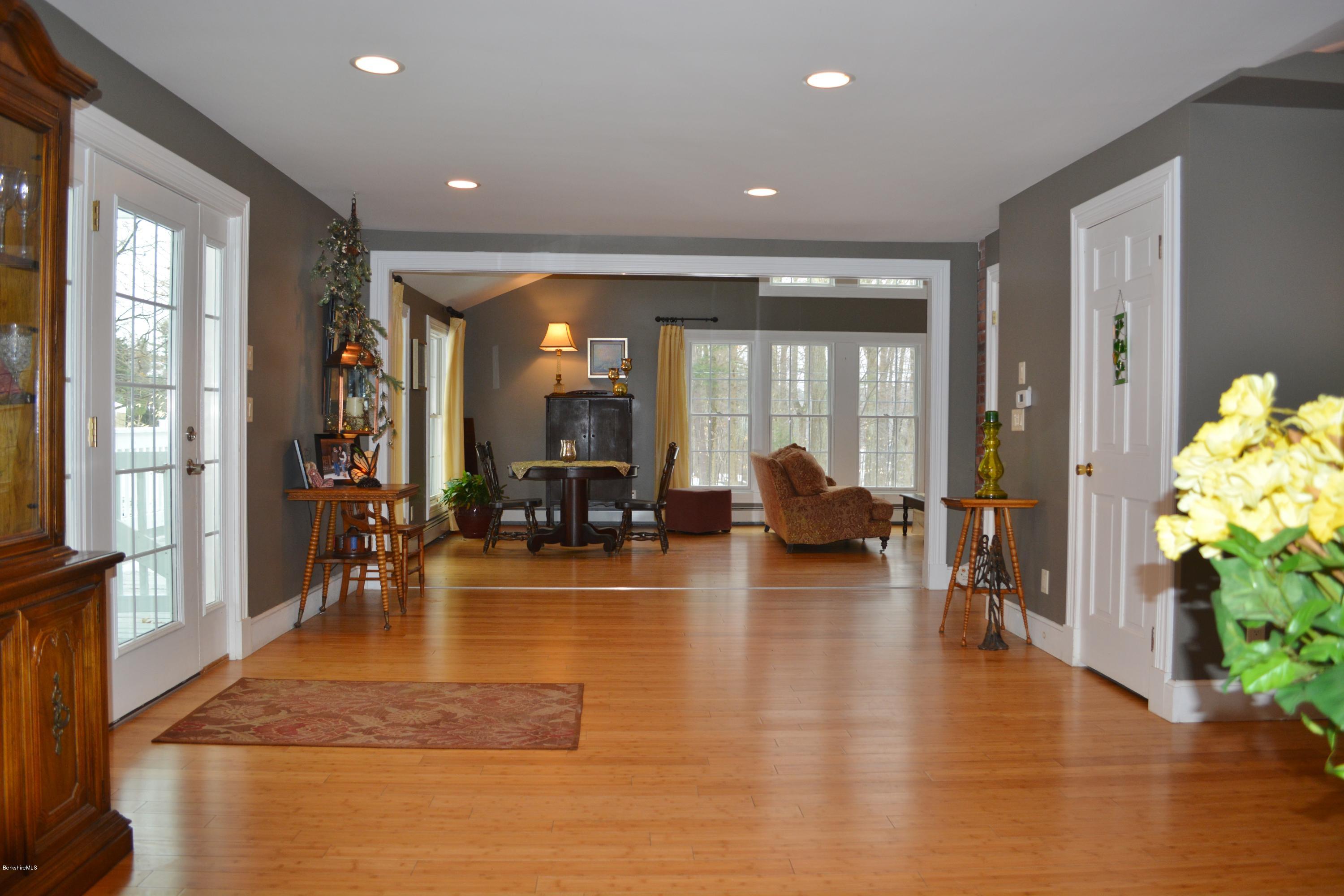 27 Kibbe Point Road Otis, MA 01029 - Photo 6 of 30 a lobby with furniture and floor to ceiling windows