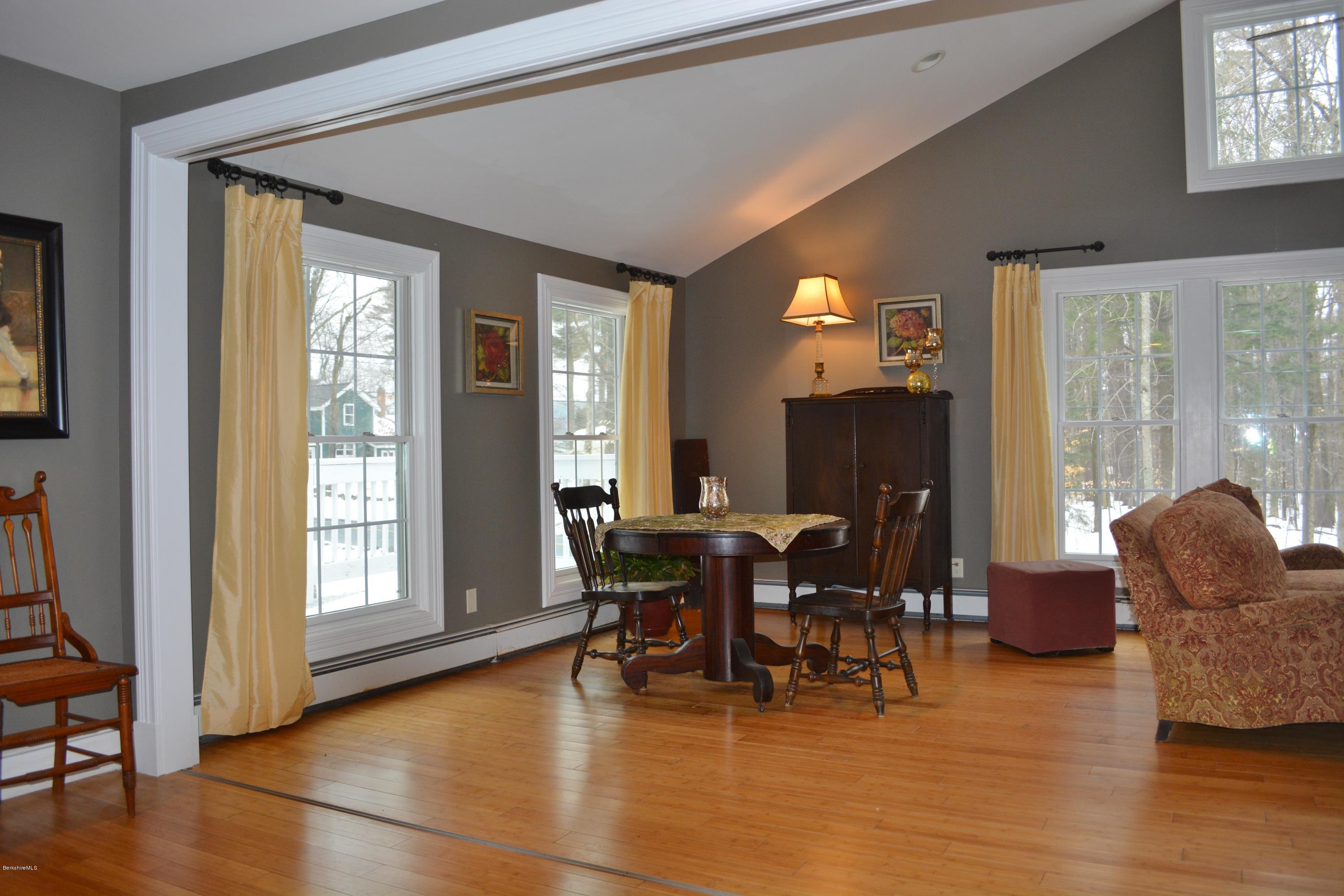 27 Kibbe Point Road Otis, MA 01029 - Photo 7 of 30 a dining room with furniture window and wooden floor