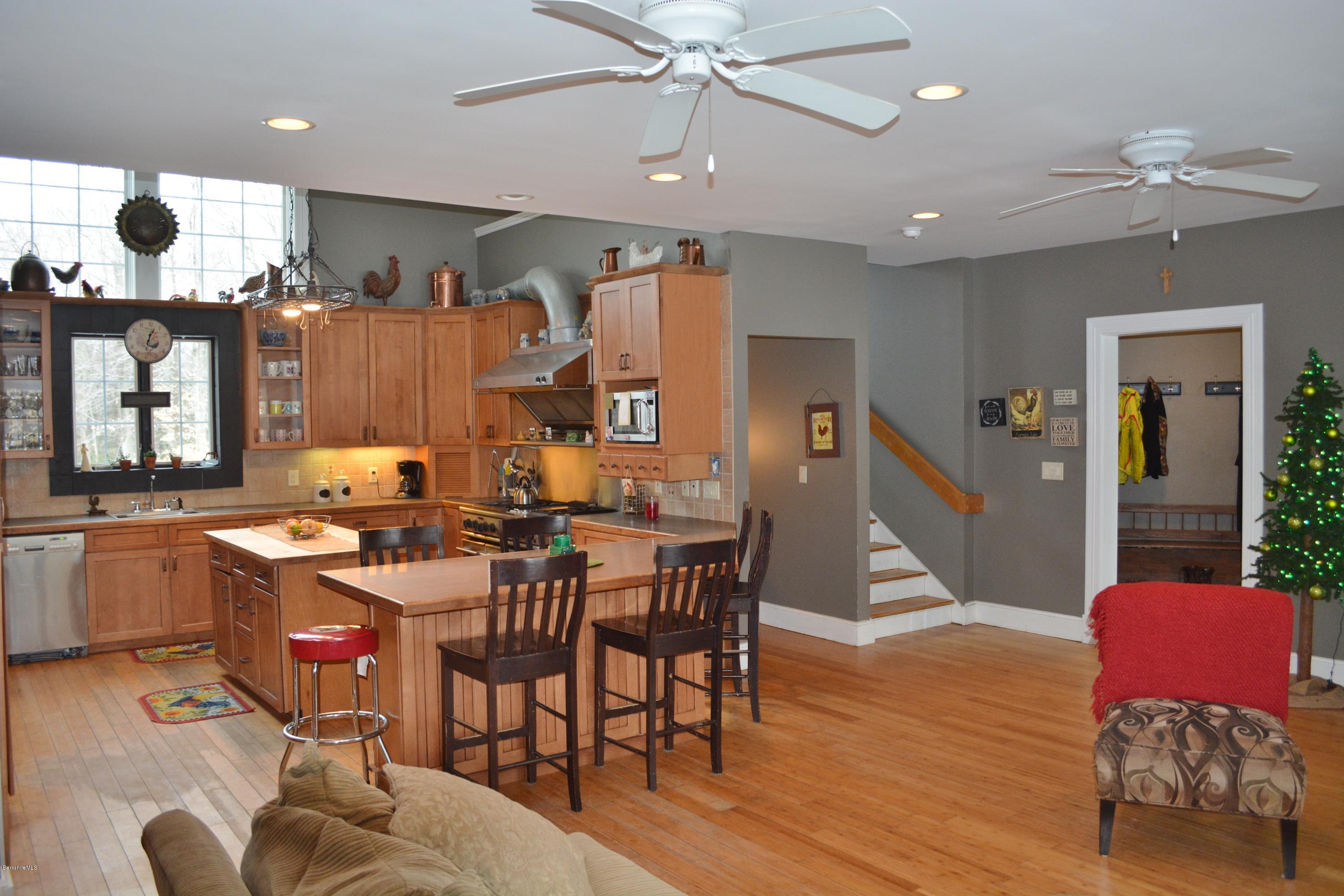27 Kibbe Point Road Otis, MA 01029 - Photo 9 of 30 a view of a dining room with furniture and wooden floor