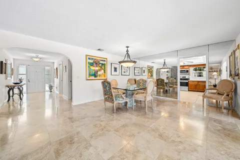 a view of a livingroom with furniture and lots of furniture