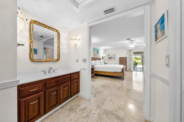 a spacious bedroom with a bed and a couch