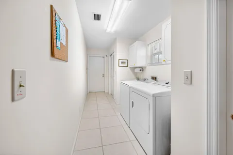 a kitchen with cabinets and a stove top oven