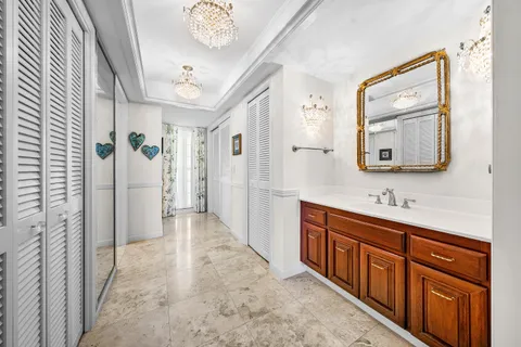 a bathroom with a sink a mirror and a shower