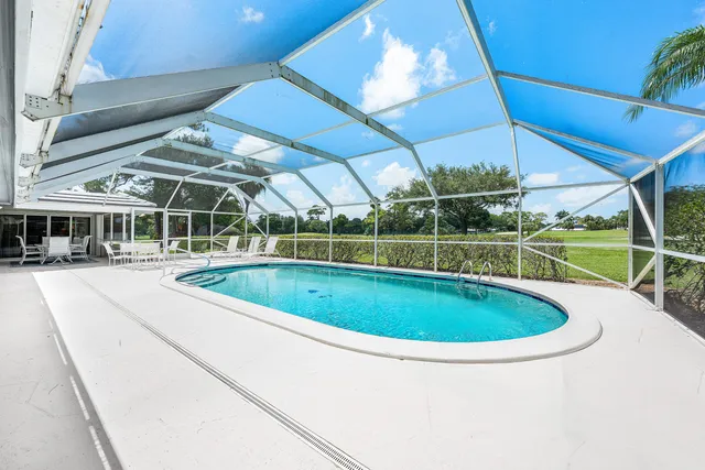 a view of a swimming pool with a porch