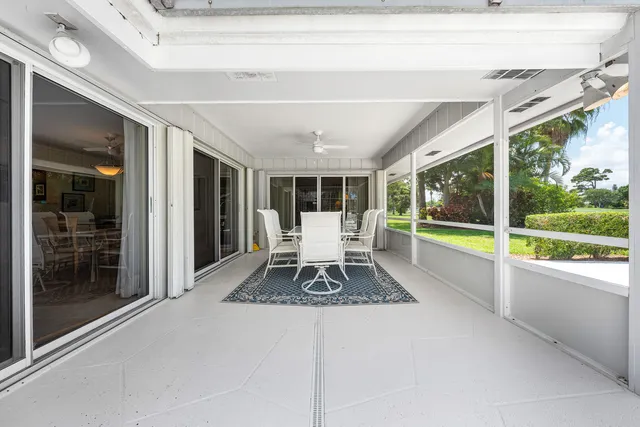a living room with large windows