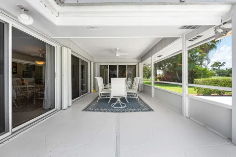 a living room with large windows