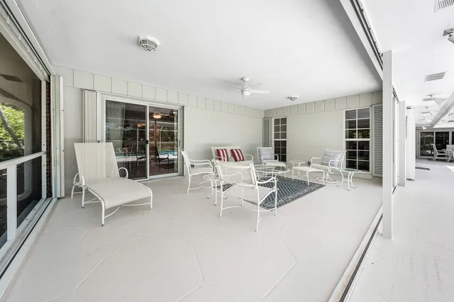 a living room with furniture and flat screen tv